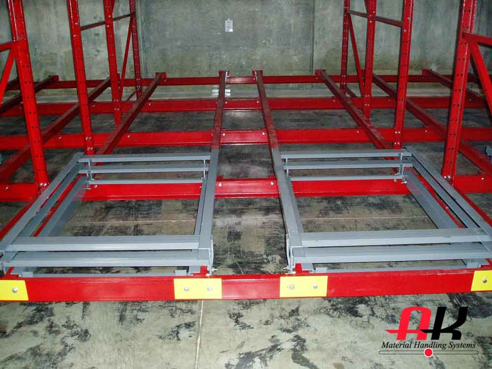Empty pushback pallet racking in a warehouse