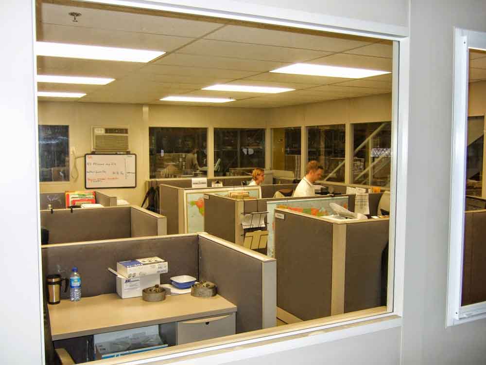 Employees hard at work in a modular office that is illuminated