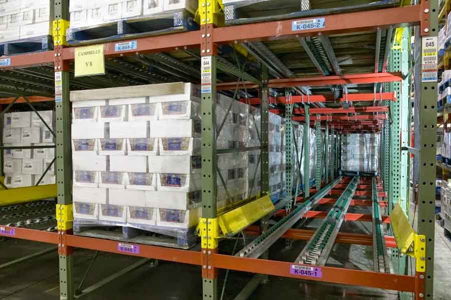 Pallet Flow Rack holding materials on one aisle and the other is half full