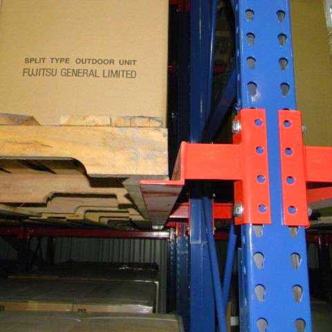 pallet racking holding a pallet with a cardboard box on top