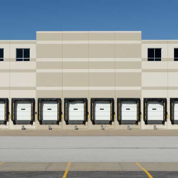outside of the warehouse with garage doors