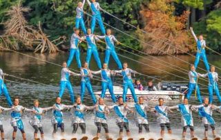 a group of water skiers making a pyramid