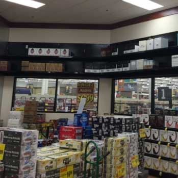 industrial racking holds a variety of beer and wine sits on industrial shelving in a cub foods