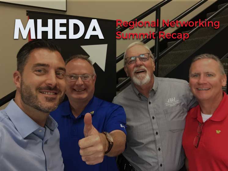 A group of men in business casual clothing smile into the camera for a selfie, the text above rthme reads MEHDA Regional Summit recap