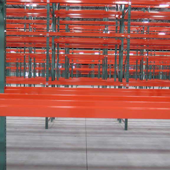 Rows of selective pallet racking go farther and farther back into the warehouse