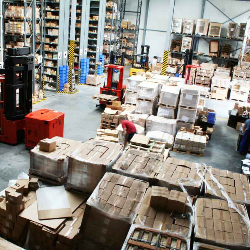 A Distribution warehouse utilizing floor storage and selective pallet rack