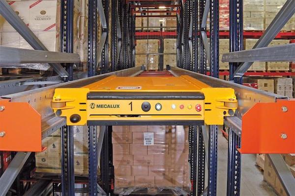 Front view of an unloaded bay of pallet rack with a semi automated pallet storage system