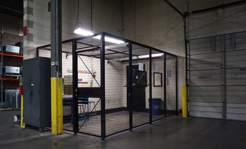 Warehouse drivers security cage being used to protect warehouse personnel.