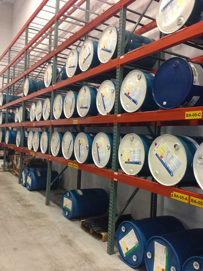 Selective pallet racking with drum cradles storing barrels otherwise known as drums in a manufacturing warehouse