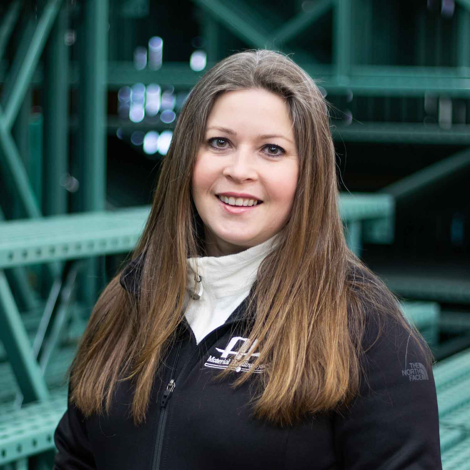 Andrea in warehouse headshot