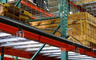 in-rack sprinkler system on selective pallet racking in a warehouse