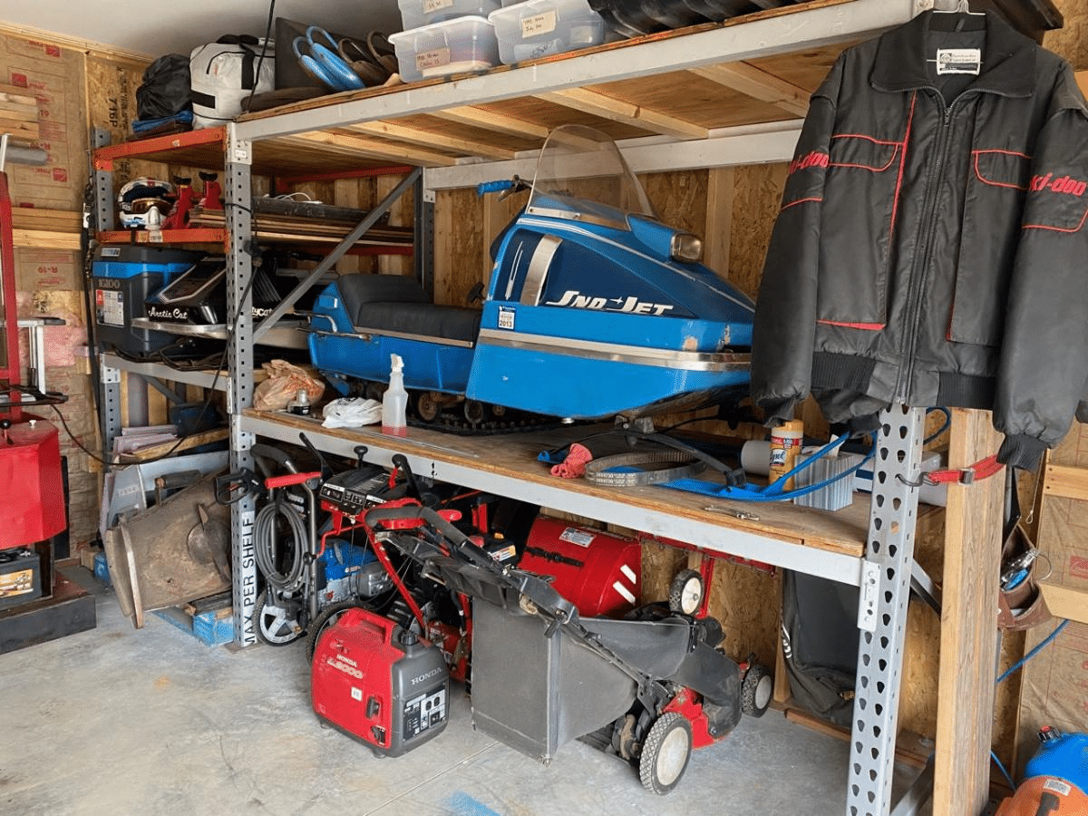 Garage racking storing a snowmobile